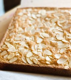 a close up of a cake with almonds on it