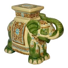 an elephant figurine is shown with decorative designs on it's body and trunk