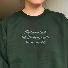 *SIZES ARE UNISEX* -I'd suggest your usual size for a more fitted look, or sizing up for a more relaxed fit. *these sweatshirts are extra comfy when oversized "My tummy hurts but I'm being very brave about it" embroidered on a comfy vintage-style crewneck. The perfect sweatshirt for any bookworm. A sturdy and warm sweatshirt bound to keep you warm in the colder months. A pre-shrunk, classic fit sweater that's made with air-jet spun yarn for a soft feel and reduced pilling. Your new favorite sweatshirt! * 50% cotton, 50% polyester * Pre-shrunk * Classic fit with no center crease * 1x1 athletic rib knit collar with spandex * Air-jet spun yarn with a soft feel and reduced pilling * Double-needle stitched collar, shoulders, armholes, cuffs, and hem * Gildan 18000 Unisex Heavyblend Sweatshirt P My Tummy Hurts, Tummy Hurts, Funky Shirts, Trendy Crewneck, Look Plus, Fitted Sweater, Air Jet, Vintage Stil, Style Vintage