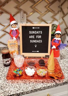 an assortment of sundaes is displayed in front of a sign