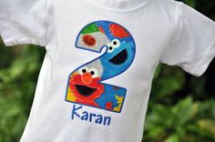 a sesame street birthday shirt with the number two on it and an elmo face