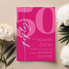 a pink 50th birthday party card with white flowers