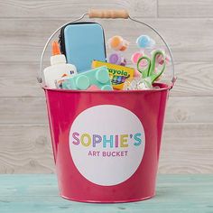 a blue bucket filled with lots of different items