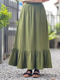 Green Flowy Cotton Skirt, Green Cotton Ruffled Bottoms, Green Bottoms With Ruffle Hem, Green Skirted Bottoms With Ruffle Hem, Green Ruffled Tiered Skirt, Green Ruffled Tiered Skirt Bottoms, Solid Cotton Lined Maxi Skirt, Casual Long Skirt With Ruffle Hem, Cotton Lined Maxi Skirt