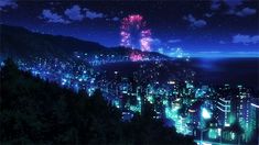 fireworks in the night sky over a cityscape with mountains and trees around it