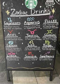 a menu for zodiac drinks on a blackboard