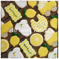 decorated cookies with lemons and baby items on them are displayed in front of the words, all good things