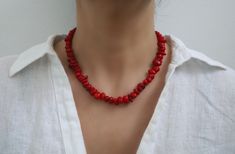 This is a gorgeous, handmade dainty chip coral necklace made with all-natural coral beads. This necklace is made of the most amazing shade of red coral beads that will go beautifully with many outfits and occasions. The minimalism of this necklace and the color of the red make this necklace simple yet beautiful and eye-catching.  The beads are approximately 8-9mm but vary due to the shape. **Do not use liquid chemicals on the beads, just use a polishing cloth** Our items are shipped in a nice mesh pouch in a gift box. All jewelry needs to be returned unworn and in its original condition and packaging.  Earrings are NOT returnable for hygiene reasons. We hold the right to deny a return if the product you have sent back does not meet our requirements. You are responsible for the return shipp Coral Necklace Outfit, Coral Choker, Red Coral Necklace, Necklace Outfit, Shade Of Red, Jewelry Summer, Red Necklace, Natural Coral, Looking Forward To Seeing You