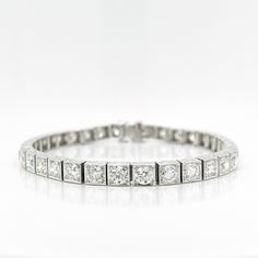 A very fine antique Art Deco period diamond and platinum tennis bracelet. Set with 34 Old European and Transitional Round Brilliant cut diamonds with an approximate 10.65 total carat weight, VVS-VS clarity, G-H-I color. Each prong set in a square platinum link.  Accompanied by a GEMLAB (Gemological Appraisal Laboratory) report. Simply a wonderful antique Art Deco bracelet! Date: Early 20th Century Overall Condition: It is in overall good, as-pictured, used estate condition. Condition Details: There is some light edge wear, some fine & light surface scratches and other signs of expected light wear consistent with age. Fineness: Unmarked for fineness. Professionally tests as Platinum. Marks: Unmarked Measurements: Length: ca. 7 1/8 in. Width: ca. 5 mm Depth: ca. 4 mm Weight: ca. 28 g Bracele Bracelet Art, Art Deco Bracelet, Diamond Tennis Bracelet, Art Deco Period, Tennis Bracelet Diamond, Antique Art Deco, Tennis Bracelet, Round Brilliant Cut Diamond, Antique Art