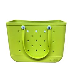 a green tote bag with two handles and holes on the front, sitting against a white background