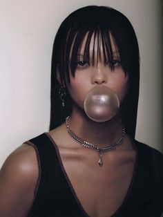 a woman with a bubble in her mouth