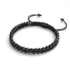 Metal Finish: Gunmetal Cord: Rainbow Black Nylon Bead Size: 4mm Length: Adjustable / One-Size-Fits-All Metal Base: Stainless Steel The Mini Vitality Bracelets are set on a soft nylon cord interwoven with twin rows of gilded 4mm beads. With their adjustable and durable nylon strand and smooth beaded pull-cord drawstrings, the Mini Vitality Bracelets are one size fits all. Adjustable Black Metal Braided Bracelet, Adjustable Gunmetal Beaded Jewelry, Adjustable Beaded Gunmetal Jewelry, Adjustable Gunmetal Bracelet For Everyday, Adjustable Black Hematite Bracelets, Casual Black Stainless Steel Braided Bracelet, Casual Black Hematite Jewelry, Adjustable Minimalist Gunmetal Bracelet, Black Beaded Bracelet With Adjustable Cord For Everyday