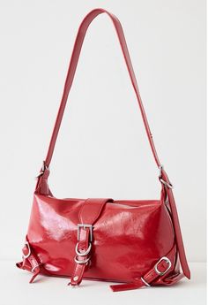 Faux leather Large red bag featuring silver hardware One main compartment with interior slip & zipper pockets Button closure Measurement approx. 7"H x 11"W x 10"D Adjustable strap 18" Red Rectangular Faux Leather Bag, Red Faux Leather Shoulder Bag With Double Handle, Red Faux Leather Travel Bag, Everyday Red Faux Leather Satchel, Burgundy Leather Shoulder Bag With Silver-tone Hardware, Red Shoulder Bag With Hasp Closure For Daily Use, Red Faux Leather Shoulder Bag, Red Faux Leather Bags For Everyday Use, Red Faux Leather Bag For Everyday Use