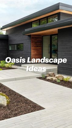 a modern house with black siding and wood accents on the front door, walkway leading up to it's entrance