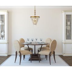 a dining room table with chairs and a chandelier