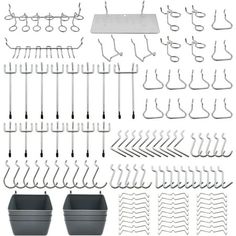 an assortment of metal hooks and pans on a white background