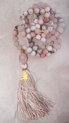 WERKSHOP X Element of Sri | 108 Matte Peruvian Pink Opal and Madagascar Rose Quartz Mala (Prayer Beads) ◇ Handmade in Seattle, Washington by our friend Kenny @ of Element of Sri◇ Embellished with a WERKSHOP logo charm w/handmade silk tassel◇ Gold tone hardware◇ Shipped in a keepsake WERKSHOP Canvas Drawcord PouchEach mala is hand created with the purpose of respecting the balance of energies we all exchange. In order to ensure only the best of intentions make it to your practice, Element of Sri Rose Quartz Mala, Positive Intentions, Om Shanti, Athleisure Leggings, Eagle Rock, Reversible Top, Athleisure Tops, Spiritual Energy, Clear Mind