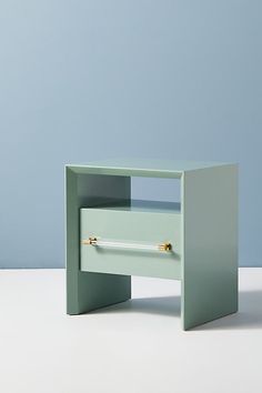 a small table with an open drawer on it