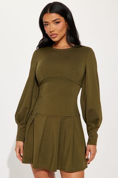 Available In Olive. Pleated Mini Dress High neckline Long puff sleeves Corset waist Pleated Back zipper Stretch Length = 33" Self: 95% Polyester 5% Spandex Lining: 100% Polyester Imported | Kiana Pleated Mini Dress in Olive Green size Medium by Fashion Nova