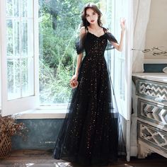 Black A-line Tulle Evening Dress, Black Floor-length Prom Dress, Black Sequined Evening Dress For Gala, Black Prom Dresses For Prom Season, Black Tulle Dress For Party, Black Sequined Gown For Evening, Black Gown For Night Out Party Season, Black Sequined Gown For Evening Events, Black Gown For Party Season And Night Out