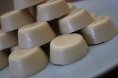 a pile of white chocolates sitting on top of a counter