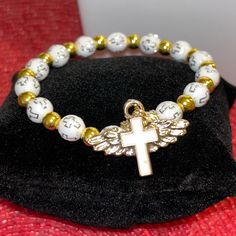 * Brand New! (Removed From Packaging For Photos) * Features A Cross Charm With Angel Wings. White Beading Also Feature Crosses And Are Accented With Gold Beading. * Bracelet Is A Stretch Bracelet (Os Fits Most) * Smoke Free Environment Thank You For Your Support Of My Small Business! I Ship Within 1-3 Business Days! Bundle Items For Deep Discounts! Angel Wings Gold, Gold Angel Wings, My Small Business, Cross Charms, Stretch Bracelet, Gold Beads, Cute Jewelry, Angel Wings, Stretch Bracelets