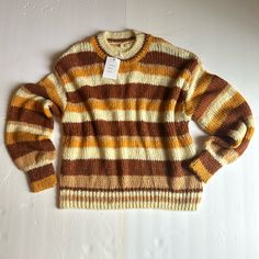 Size Small Brand New With Tags Knitted Oversized Sweater Cream, Rust Orange, Mustard And Tan Stripes Measurements: Arm Pit To Arm Pit: 24 In Shoulder To Hem: 24 In Casual Orange Acrylic Sweater, Retro Chunky Knit Fall Sweater, Retro Chunky Knit Sweater For Fall, Brown Soft Knit Acrylic Sweater, Striped Knit Sweater For Fall, One Size Brown Knit Sweater, Oversized Retro Acrylic Sweater, Brown Acrylic Soft Knit Sweater, Casual Orange Knit Sweater