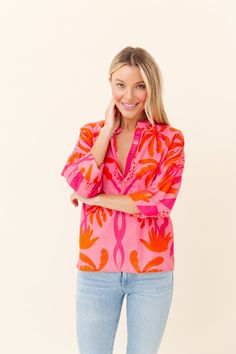 Made from our light and airy cotton voile, and detailed with our signature hand-touched embellishments. Drew is designed with artfully gathered sleeves that give it a relaxed silhouette. Cotton Voile - light and airy Hand Embellished Neckline Runs true to size Relaxed Fit Split Neck Vacation Blouse, Relaxed Fit Split Neck Blouse For Vacation, Relaxed Split Neck Blouse For Vacation, Pink Blouse With Gathered Sleeves For Daywear, Pink Blouson Sleeve Tops For Summer, Pink Cotton Top With Gathered Sleeves, Cotton Vacation Blouse With Split Neck, Summer Tops With Blouson 3/4 Sleeves, Feminine Summer Blouse With Split Neck