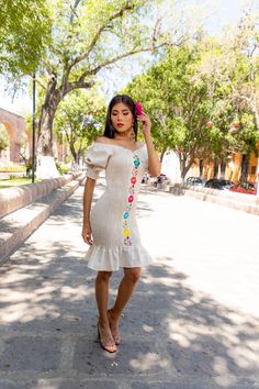 This Beautiful Dress boasts a Traditional Mexican floral design combined with a modern style dress. The embroidered elastic bodice combined with the off the shoulder sleeves makes it fun and flirty. It's made out of fine Mexican cotton and has an elastic bodice for an adjustable fit. This dress is handmade and embroidered by Mexican Artisans in Guanajuato, Mexico. Summer Embroidered Dress With Straight Neckline, Spring Embroidered Dress With Straight Neckline, Fitted Short Sleeve Embroidered Midi Dress, Fitted Embroidered Knee-length Mini Dress, Off-shoulder Embroidered Spring Dress, Spring Knee-length Embroidered Fitted Dress, Embroidered Fitted Mini Dress, Fitted Knee-length Embroidered Dress For Spring, Fitted Knee-length Off Shoulder Summer Dress