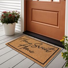 a welcome mat that says happy new year's eve next to a potted plant