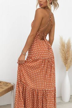 Fall in love with this stunning open back lace-up polka dot tiered maxi dress! Its unique design and playful pattern will make you stand out in any crowd. The open back adds a touch of effortless elegance, while the lace-up detail showcases your figure. Perfect for any occasion, this dress will make you feel confident and stylish.Material:Cotton+PolyesterSIZEUS/CANBUSTWAISTHIPSS2-433"-34"26"-27"36"-37"M6-835"-36"28"-29"38"-39"L10-1237"-39"30"-32"40"-42"XL12-1440"-42"33"-35"43"-45" Vacation Maxi Dress With Lace-up Back, Chic Flowy Maxi Dress With Lace-up Back, Backless Sundress Maxi Dress With Lace-up Back, Fitted Maxi Dress With Lace-up Back For Vacation, Flowy Backless Maxi Dress With Lace-up Back, Tiered Maxi Dress With Tie Back For Brunch, Beach Sundress With Lace-up Back, Strappy Back Lace-up Maxi Dress For The Beach, Beach Maxi Dress With Strappy Lace-up Back