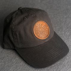 A floral stamped Leather Patch Unstructured Style Hat is the perfect gift for anyone who loves nature. All hats ship for free within the US! SPECS - Leather Patch Color Options: Natural Dublin, Nut Brown Dublin, or Cafe Chromexcel - Hat Color Options: Choose from Stone, Black, Navy, or Gray - All of our products are made to order by hand in McKinney, TX MATERIALS REAL HORWEEN LEATHER: Premium Full-Grain Leather. - Each patch is one-of-a-kind and made from part of a whole hide of leather. There w Black Dad Hat With Curved Brim As Gift, Leather Patch Cap - Gift, Leather Patch Cap As Gift, Leather Patch Cap As A Gift, Leather Patch Cap Hat Gift, Adjustable Hats With Leather Patch As Gift, Adjustable Short Brim Baseball Cap As Gift, Adjustable Short Brim Baseball Cap For Gift, Brown Curved Bill Hat For Gift