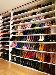 there are many pairs of shoes on the shelves