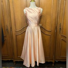 This Vintage Dress Is A Dream! The Fabric Is Silky Satin In The Most Beautiful Pink Peach Color. The Huge Bow In The Back Is Over The Top! Please Note-She Needs To Be Professionally Cleaned. There Are Several Spots (Please See Photos) That Need To Be Professionally Removed. Ptp: 15 Waist: 12 Length: 47 Bundle & Save I Ship Fast! Are You New To Poshmark Here’s A Free Gift! Use Code: Bonniecb For $10 Off Your First Purchase! *I Do My Very Best To Take Pictures Of Any And All Flaws And Imperfections. I Always Strive For Excellent Customer Service To Ensure Repeat Customers. The Color Of Items May Vary Depending Upon Lighting. Tradition Peach Sleeveless Dresses For Wedding, Peach Sleeveless Wedding Dresses, Sleeveless Peach Wedding Dress, Peach Sleeveless Prom Dress, Peach Fitted Dress For Bridesmaids, Fitted Peach Bridesmaid Dress, Peach Sleeveless Maxi Dress For Party, Sleeveless Peach Maxi Party Dress, Sleeveless Peach Maxi Dress For Party