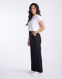 DESCRIPTION Discover the Timeless Straight Leg Ponti Pant, a wardrobe essential from White & Co. that promises comfort and style for any setting. Crafted in classic black, these pants offer a flattering, relaxed fit and showcase a subtle yet chic black tape down the sides. The perfect versatile work-to-weekend piece, they pair beautifully with a crisp white tee and classic blazer for a monochromatic look, or add a pop of colour with a patterned blouse for an effortless transition from day to nig Black Straight Pants Outfit, Black Pants Outfit, Patterned Blouse, Black Tape, Casual Work Outfit, Stylish Work Outfits, Classic Blazer, Black On Black, Black And White Colour