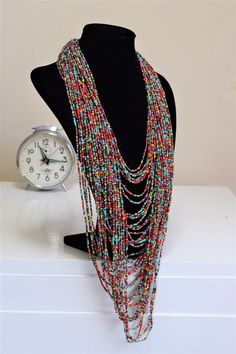 Unique African Maasai Handcrafted Beaded Necklace with an Elegant Look and Brilliant Finish.**GET FREE SHIPPING FOR ADDITIONAL ITEMS PURCHASED.Yes, Buy Multiple Items and pay shipping for 1 item only- The rest ships Free. (No Limits on the number of Multiple items). With a faster delivery time of 3 days via DHLExpress, Worldwide. Ordinary/Standard Shipping also available upon request. We Custom Make to Suit Your Taste.Available In All Colors and Sizes.For wholesale please chat me up for discount Bohemian Multi-strand Beaded Chain, Artisan Multicolor Multi-strand Beads, Artisan Multicolor Dangling Beads, Bohemian Multi-strand Dangling Beads, Artisan Multicolor Multi-strand Beaded Necklaces, Bohemian Multi-strand Small Beads, Bohemian Multi-strand Polished Bead Necklace, Bohemian Multi-strand Polished Beaded Necklace, Bohemian Multi-strand Beaded Necklace