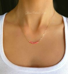 "Genuine Pink Coral Necklace ~ Sterling silver, 14k gold fill, or rose gold fill Vibrant colored genuine pink coral beads are set in a dainty little row and attached to a sparkling chain. ~ Small pink coral beads adorn this sparkly necklace ~ Dainty chain is available in both sterling silver, 14k gold fill or rose gold fill ~ Total chain length shown on model (with coral section) is 17 Inches ~ Chain closes with a sterling silver, 14k gold fill or rose gold spring clasp ~ This item is handmade, Beach Wedding Necklace, Coral Bridesmaid, Small Dangle Earrings, Sparkly Necklace, Beach Necklaces, Coral Bracelet, Fine Silver Jewelry, Coral Earrings, Coral Jewelry