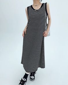 A tank top dress that you will want to wear in the coming season.

Not only can you wear it alone, but you can also wear it for many seasons by layering it with a shirt or knit cardigan.

We recommend styling your look with voluminous sneakers or sandals for a relaxed look.
◾️Model
Height/Weight：158cm(62.2in)/45kg(99.2lb)
Fitting Size：S





Cm
(inches)

Length
Chest
Shoulder


S
112(44.0)
94(37.0)
33(12.9)


M
114(44.8)
98(38.5)
33.8(13.3)


L
116(45.6)
102(40.1)
34.6(13.6)


XL
118(46.4)
106(41.7)
35.4(13.9) Casual Black Sleeveless Maxi Dress, Casual Sleeveless Midi Dress For Day Out, Black Midi Dress For Spring Layering, Casual Midi Dress For Daywear, Casual Black Midi Dress For Day Out, Casual Cotton Sleeveless Dress, Casual Black Cotton Midi Dress, Black Cotton Midi Dress Casual Style, Casual Longline Maxi Dress For Summer