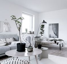 a living room filled with furniture and a flat screen tv