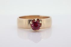 Amazing find. Stunning Gold solitaire ring with a round claw set ruby. Condition: No visible wear. Ruby is in excellent condition. Unmarked tests 10k gold. Details: 10k Yellow Gold - Ring total weight 5.0 grams.  Ruby measuring 4.5mm round. 5.5mm wide shank size 18 This is a unique ring you will not find anywhere else. Vintage, estimated to be 1920s. 10k Gold Ring, Gold Solitaire Ring, Sarasota Fl, Unique Ring, Ruby Ring, Wide Bands, Sarasota, Gold Details, 10k Gold