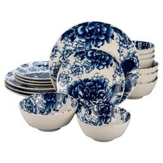 blue and white dinnerware set with flowers on the front, in various sizes and colors