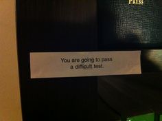 a piece of paper taped to the side of a door that says, you are going to pass a difficult test