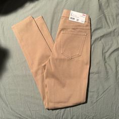 Tan Colored, New With Tags Trendy Khaki High-waisted Jeans, Beige Stretch Casual Jeans, Khaki High Waist Stretch Jeans, Beige Stretch Jeans Casual Style, Spring Stretch Khaki Pants, Beige Slim Fit Bottoms For Spring, Casual Fitted Leggings With Pockets, Casual Straight Leg Cotton Leggings, Casual Cotton Straight Leg Leggings