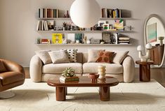 a living room filled with lots of furniture and bookshelves on top of shelves