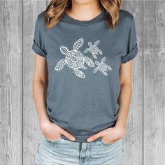 Women's Bella Tri-Blend relaxed unisex fit T-shirt with a Sea Turtle screen printed graphic design.  Super soft, stretchy, and comfy material.   Available with black or white ink! FIT: Follow the image size chart Unisex Fit - Runs Large - Long Length  Suggest sizing down if you prefer a more fitted look instead of relaxed -  Bella 3.8 oz  Super Soft hand and lightweight  -  Tri Blends:  50% Poly, 25%  Cotton, 25%  Rayon -  Does not shrink -  Hand screen printed to order in Oregon - Model is wearing a size small Fashion Fitted Style  http://etsy.me/2qjx3lC ♥ All of our tees are hand-printed to order in our shop in Portland Oregon! ♥ RETURNS & EXCHANGES We gladly accept exchanges and returns if not worn.   Please follow the chest measurement size guide for fit if you are unsure.  We custom p Comfortable Blue T-shirt With Graphic Print, Sublimation Print Crew Neck Graphic Tee, Graphic Tee With Sublimation Print And Crew Neck, Graphic Tee With Sublimation Print In Tri-blend Fabric, Pre-shrunk White Print Graphic Tee, Tri-blend Graphic Tee With Sublimation Print, Tri-blend Graphic Tee With Screen Print, Tri-blend Crew Neck T-shirt With Screen Print, Comfortable Fit Graphic Tee With Short Sleeves