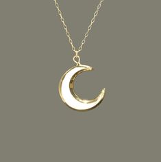 Moon necklace, crescent moon pendant, celestial, sea shell necklace, moon goddess, a mother of pearl moon on a 14k gold filled chain A one of a kind, mother of pearl crescent moon hanging peacefully from a 14k gold filled chain in the length of your choice! The moons measure aprox 20mm. Need a few reasons to love Mother of Pearl other than for its beauty? ♥ Protection ♥ Calming Mother of Pearl is a 1st Anniversary gemstone. Planet - Moon, Neptune A protection stone, Mother of Pearl brings the ge White Celestial Necklace With Moon Phase, White Moon Shaped Mystical Necklace, White Moon Phase Celestial Necklace, Mystical Moon Shaped White Necklace, White Celestial Moon Phase Necklace, Mystical White Moon Necklace, Mystical White Moon-shaped Necklace, White Celestial Necklace With Moon Charm, White Moon Charm Necklace