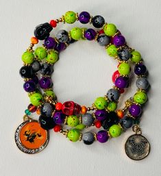 Embrace the spooky season with our Speckled Stone Bead Halloween Charm Bracelet, featuring hauntingly beautiful skull beads. This handcrafted bracelet is a perfect blend of earthy tones and eerie charm, designed to capture the essence of Halloween in a stylish and unique way. The bracelet is made with speckled stone beads that add a natural, textured look, perfectly complementing the detailed skull charms. Each skull bead adds a touch of spooky flair, making this bracelet a must-have accessory for Halloween lovers. Whether you're dressing up for a party or simply want to infuse some seasonal spirit into your everyday look, this bracelet is the perfect choice. Crafted with memory wire, this bracelet offers a flexible, comfortable fit for any wrist size, making it an ideal piece for yourself Handmade Halloween Festival Bracelets, Handmade Halloween Festival Bracelet, Bohemian Halloween Gift Bracelets, Bohemian Bracelets For Halloween Gift, Halloween Gift Stretch Bracelet With Round Beads, Bohemian Handmade Bracelets For Halloween, Handmade Bohemian Bracelets For Halloween, Bohemian Halloween Jewelry With Round Beads, Handmade Beaded Bracelets For Halloween