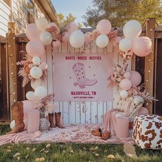 a decorated stage with balloons and boots