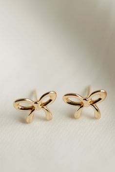 Rumor has is that 2024 is the year of BOWS! These super cute, bow stud earrings are the dainty, delicate, and prefect for all day wear. Includes two gold or silver-plated bow studs Approx. 1/2" Choose from either gold or silver Girly Christmas Gifts, Earring Stack, Everyday Wear Jewelry, Jewelry Christmas Tree, Bow Earrings, Cute Bow, Holiday Jewelry, Statement Bracelet, Everyday Earrings