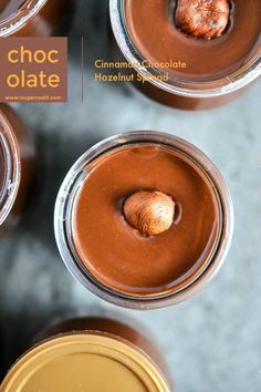 three glasses filled with chocolate desserts on top of a gray surface and the words choc oate above them